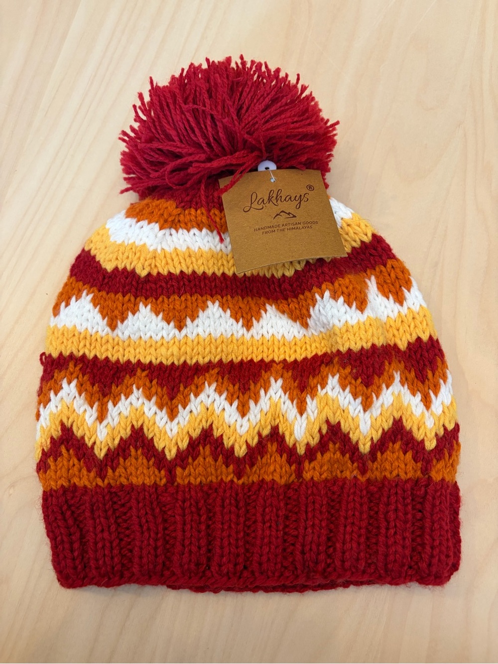 Lakhays Striped Pom Beanie Hat in Red, Yellow & White. Made in Nepal
